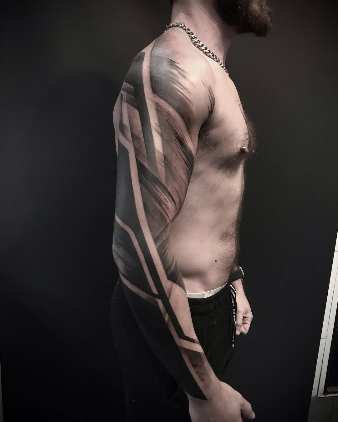 Tatouage design géométrique asymétrique épaulé — ninoartwork
