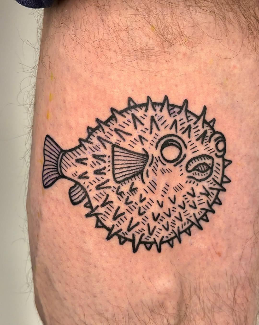Pufferfish tattoo on hand by marvin_tat