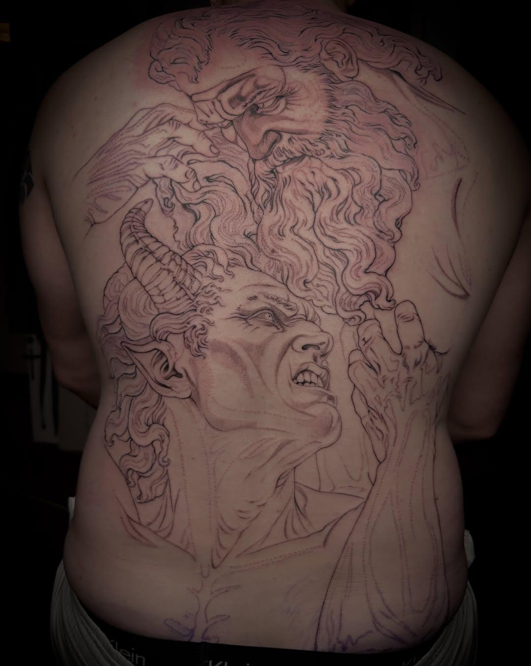 Large mythological backpiece tattoo in progress — Medusa with horns and serpents