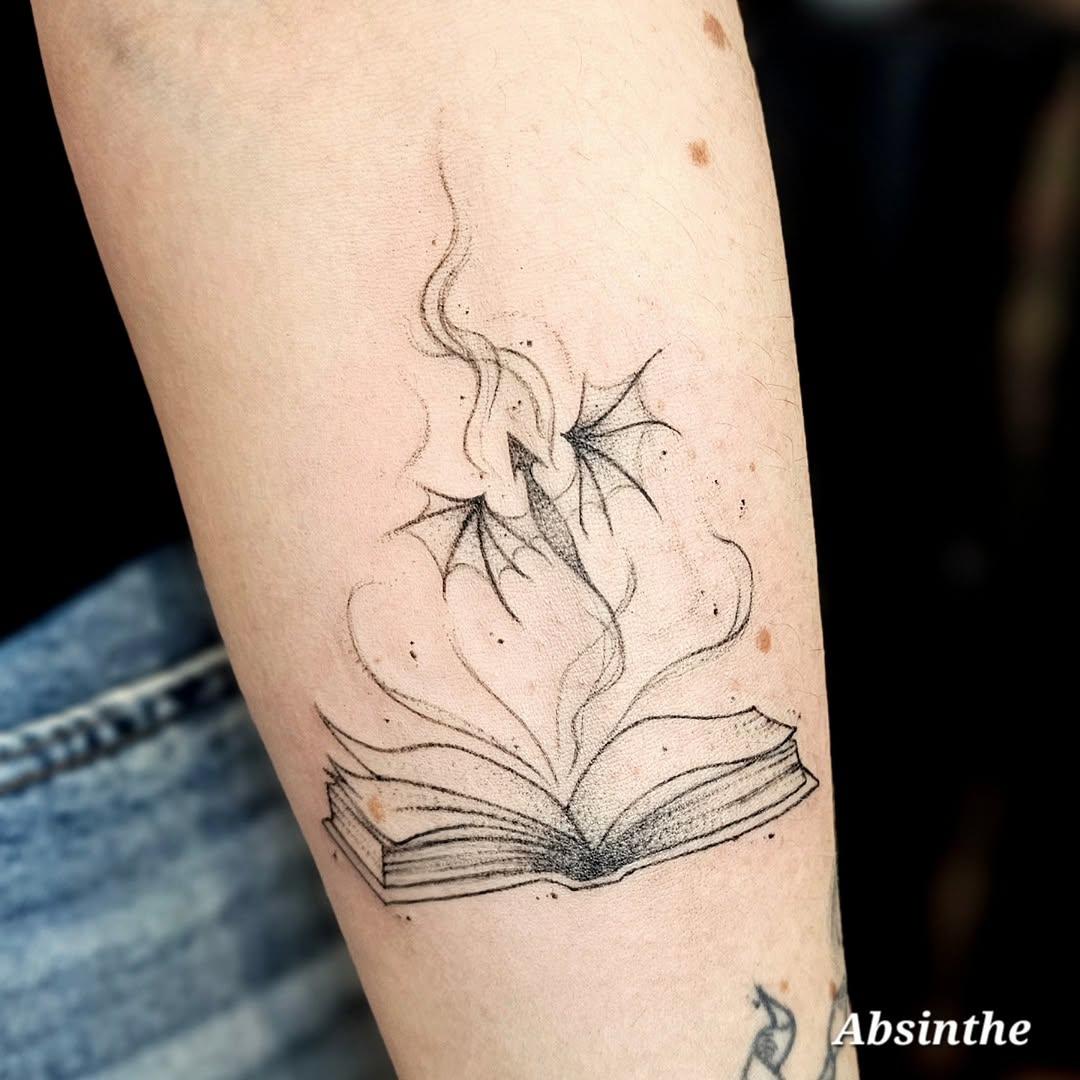 Tatouage dragon et livre — __artemisia_absinthium__