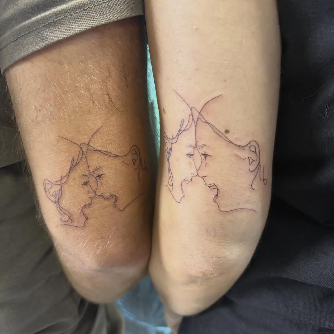 Tatouage Deux profils face à face one-line — l_aiguilleuse